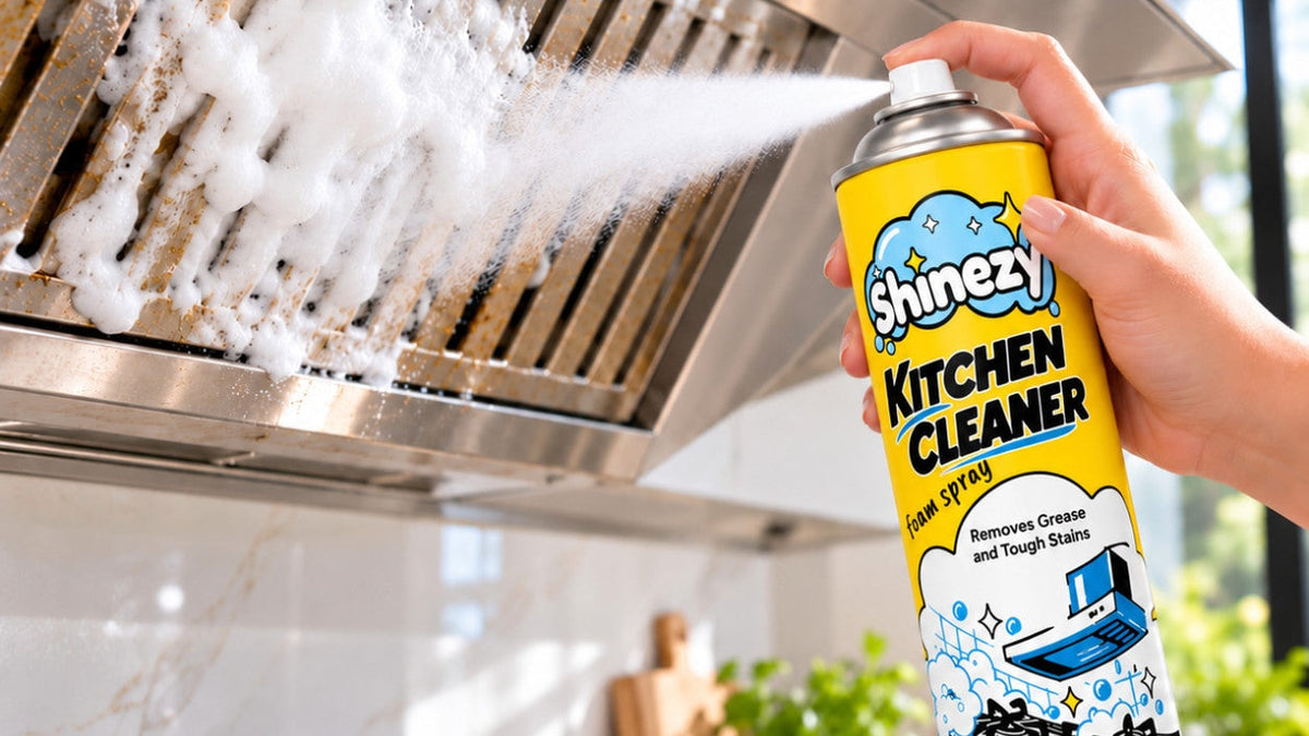 Spraying Shinezy Kitchen Cleaner foam onto a greasy kitchen chimney filter