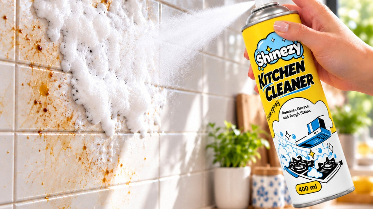 Spraying Shinezy Kitchen Cleaner foam onto greasy kitchen wall tiles