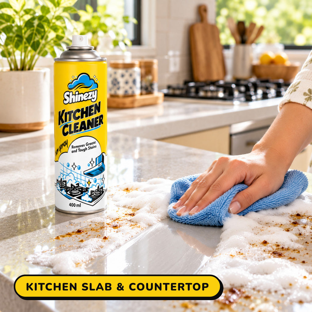 Wiping Shinezy Kitchen Cleaner foam off a kitchen slab with a cloth