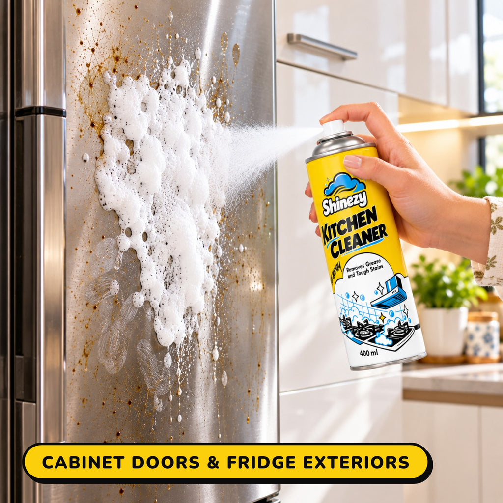 Shinezy Kitchen Cleaner foam sprayed on a fridge door beside a cabinet