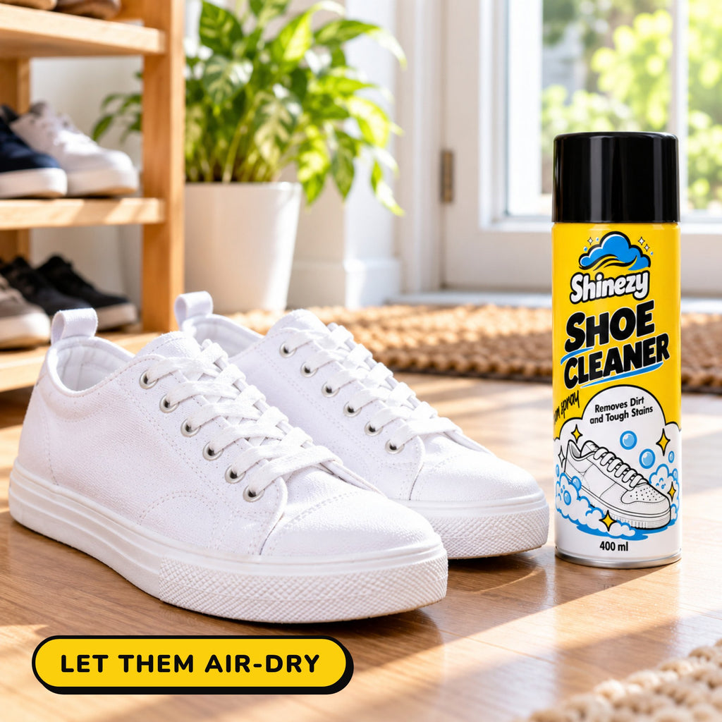 Clean white sneakers air-drying beside a can of Shinezy Shoe Cleaner