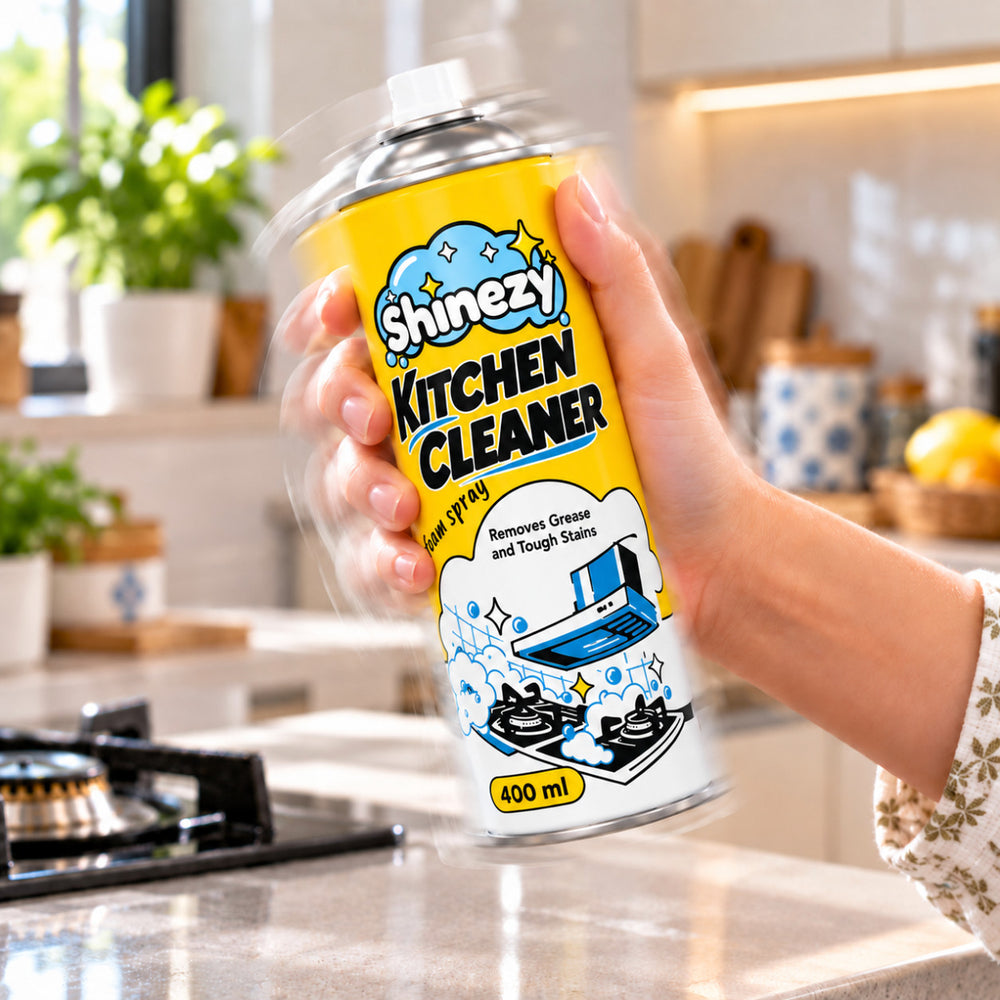 Shaking a can of Shinezy Kitchen Cleaner foam spray before cleaning a gas stove